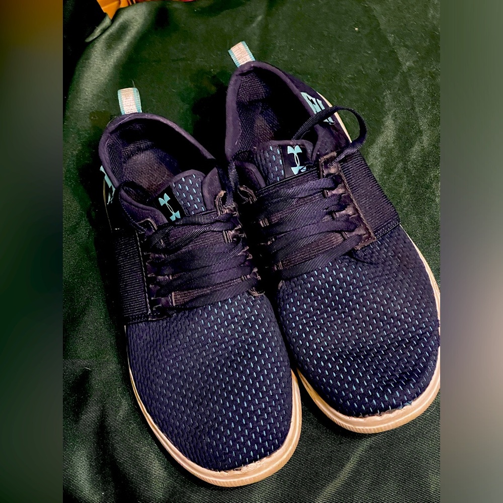 Under armor brand, blue tennis shoes. Size 8 -preowned